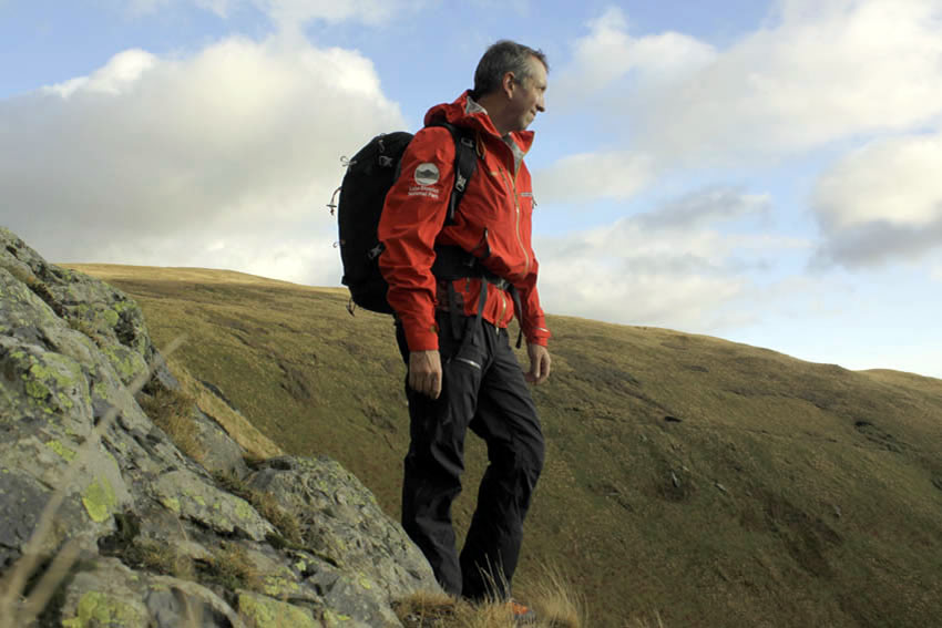 Walker on top of a high fell in the Lake District