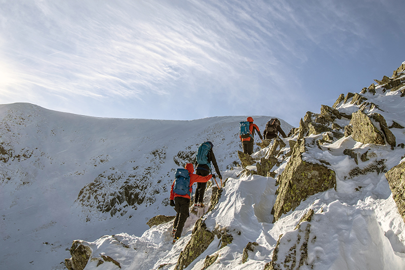 A group of people climbing Helvellyn%